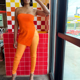 Model wearing orange metallic pants