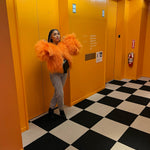 A model in an orange fur coat